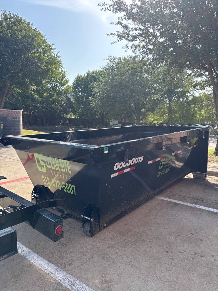 Clean Site Experts roll off dumpster in a parking lot